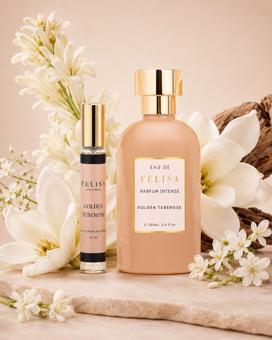 Frasco de 100 ml e miniatura de 10 ml do perfume Golden Tuberose da Felisa, cercados por flores brancas de tuberosa
